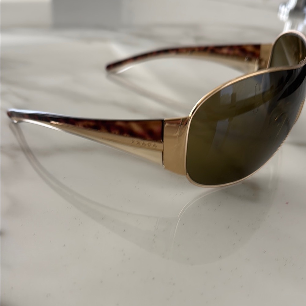 Prada Women's Sunglasses with Gold Frame and Brown Lenses
